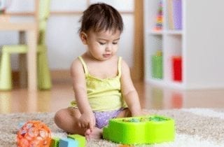 Toddler on toy piano
