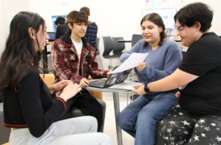 Group of students with a laptop