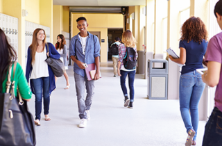 Students walking in school hallway