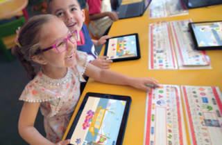 Children learning with tablets