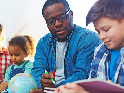 A teacher and students reading