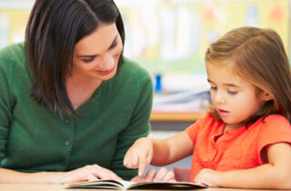 A teacher and student reading